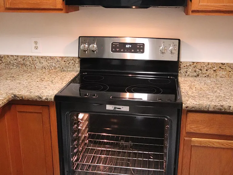 New Range with self-cleaning oven and gadiant glass top.