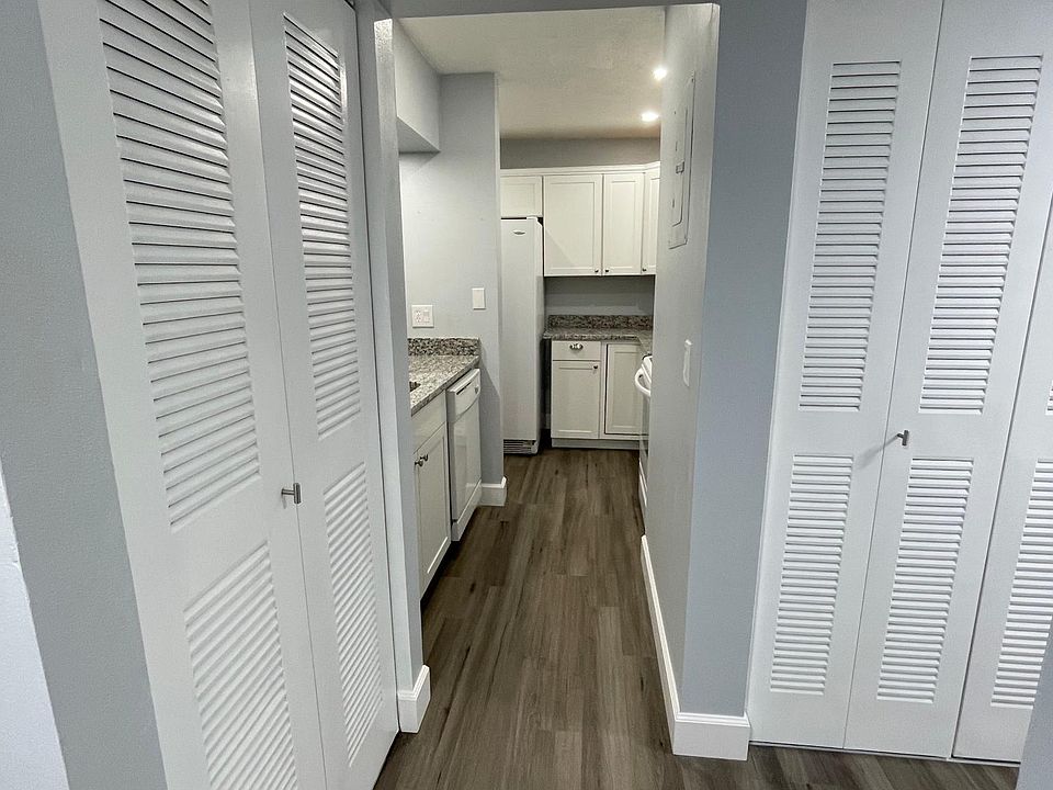 Luxury Vinyl Plank Flooring and well lit Kitchen.