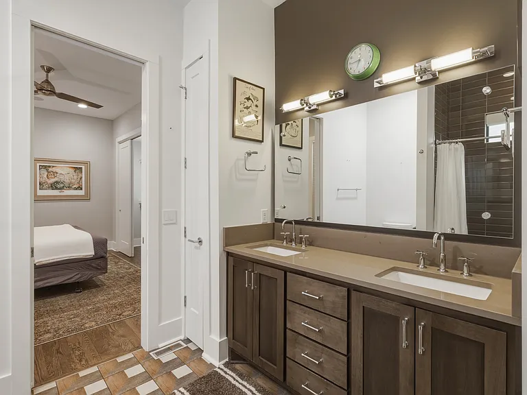 Bathroom #2 is attached to both Bedroom #2 & 3 with dual vanities + shower/tub combo.