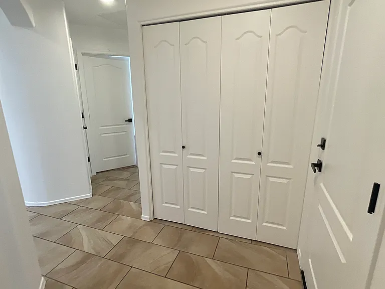 Hallway with laundry closet