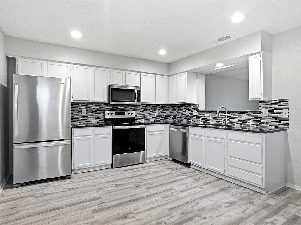 Kitchen with room for dining table. Refrigerator will stay.
