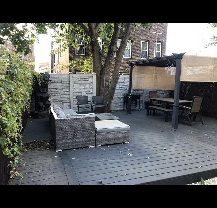 Outside common area with sectional sofas, dining table, chairs, outside cooler, propane grill.... great area to escape, relax, and BBQ...