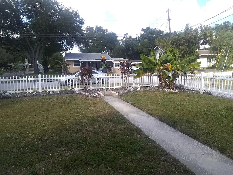 Front yard with white fence