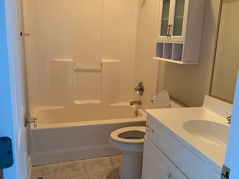 full bath for bedroom 3 and 4. This area of two bedrooms and bath is separated from house by a door and a hallway