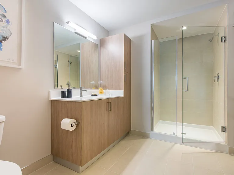 Tile floored and shower bathrooms with Italian cabinetry and eco-friendly pluming