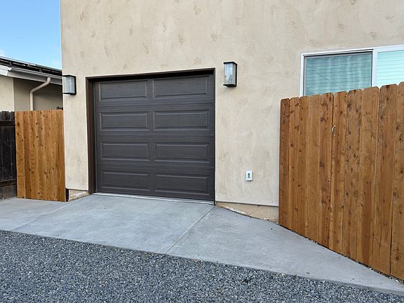 One car attached garage, access through back alley