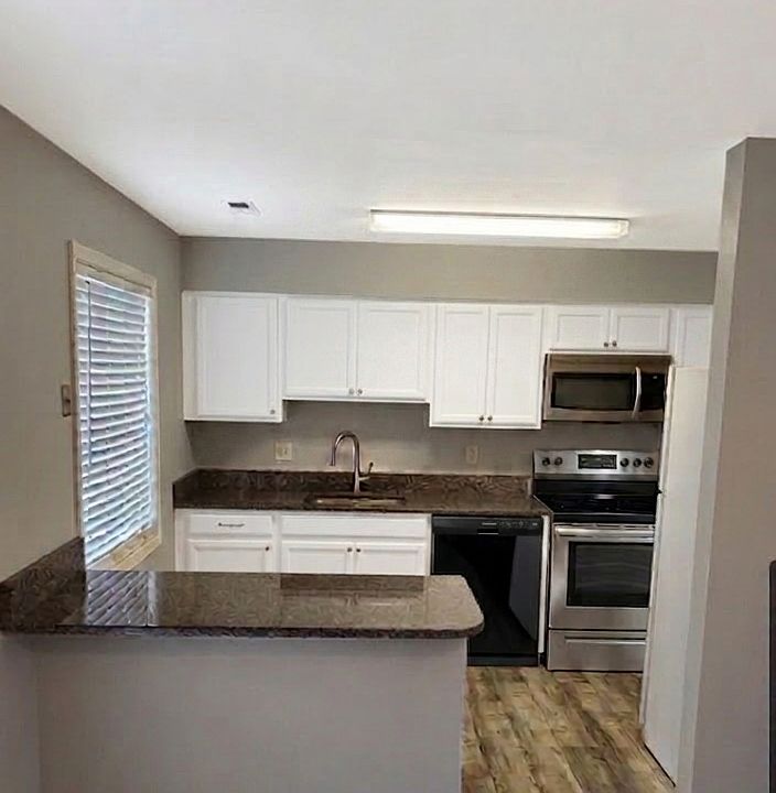 new stove and LVP floors