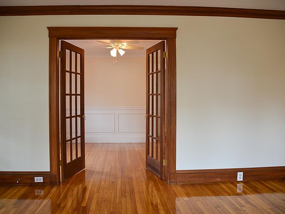 Formal Dining Room with Wainscoting and French Doors