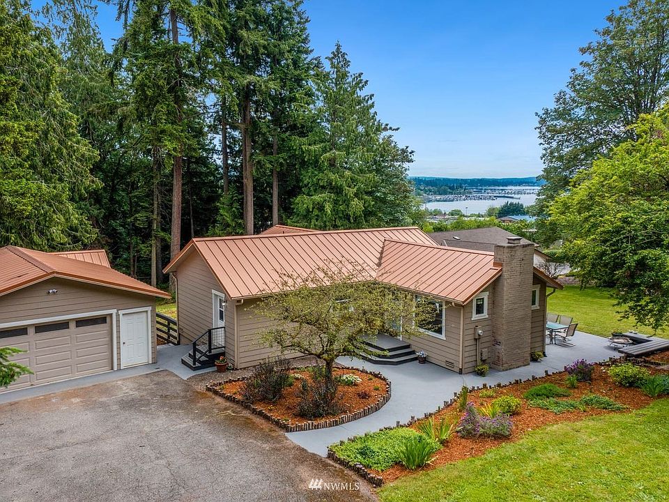 View of Liberty Bay, the Marina and Mt. Rainier can be seen from this small areage parcel close to Poulsbo - The County records indicate a build in 1937 - The inside doesn't!