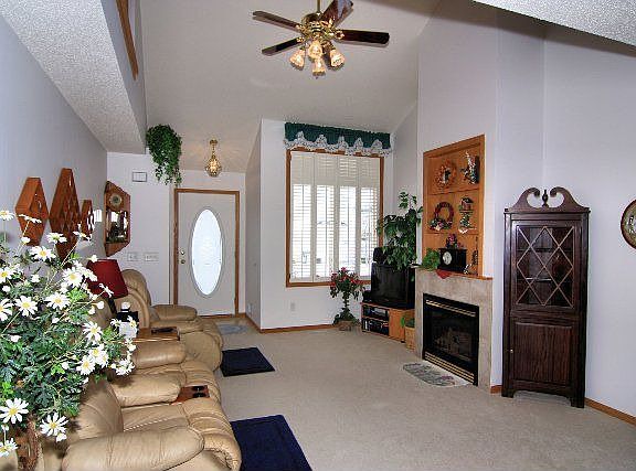 Living room with cathedral ceiling & gas fireplace