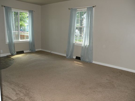 Living room with newer carpet.