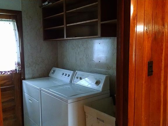 Laundry with door to back