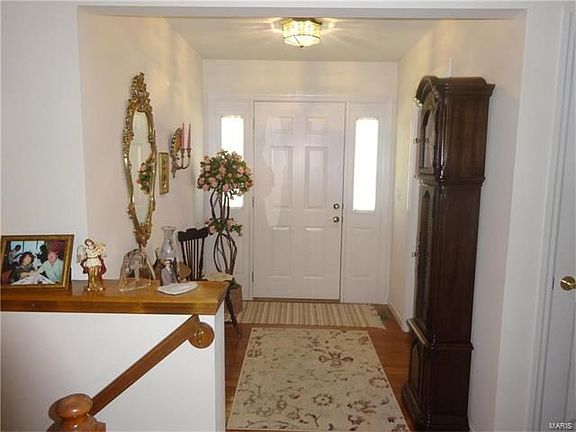 Large entry way with beautiful hard wood flooring
