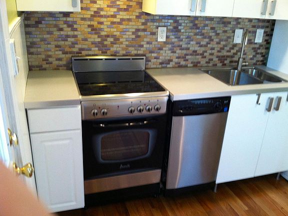 Clean and well appointed kitchen has a breakfast bar (not shown).