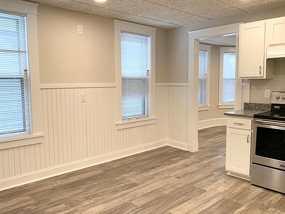 Spacious Eat-in-Kitchen with Recessed Lighting, Large Windows and Custom Blinds Throughout.