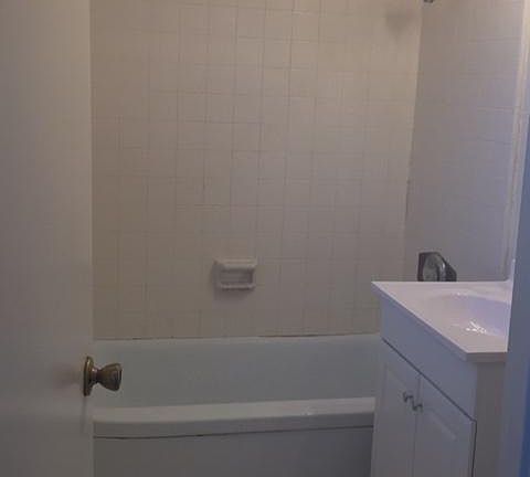 Bathroom with tub and shower head