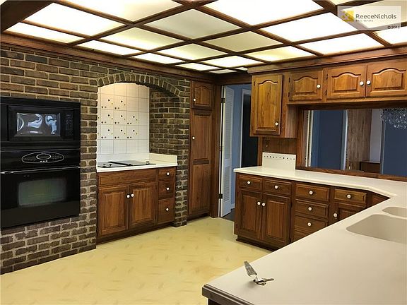 Custom Kitchen newer counter tops, custom cabinets and brick recycled from the KC stockyards