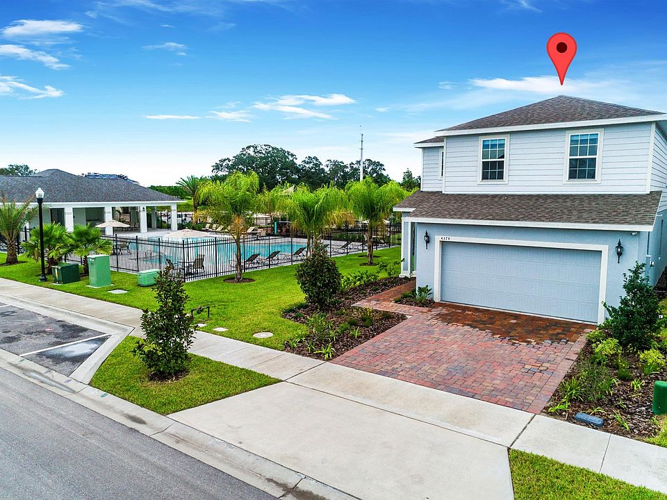 Front of Home with Pool on the Side