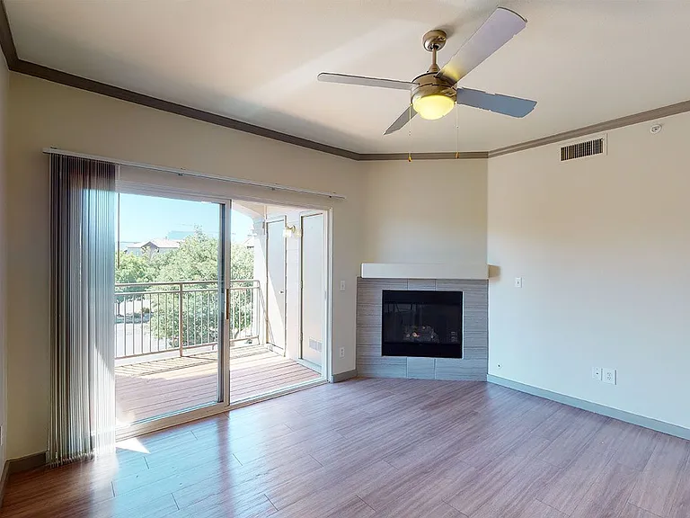 Apartment living room with wood-style flooring.