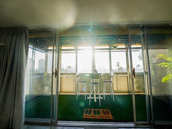 Private enclosed balcony with peak-a-boo view of ocean water & stunning views of Downtown Long Beach.