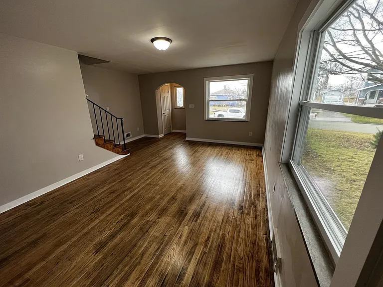 The front room includes ample lighting thanks to large windows