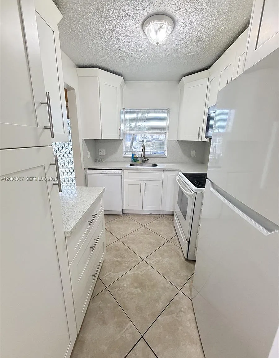 9949 Sandalfoot Blvd — Photo 3