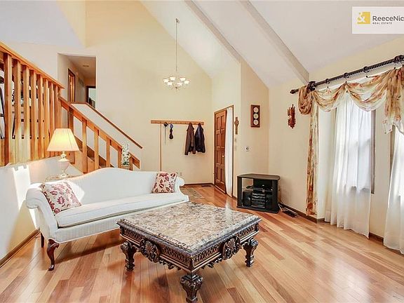 Alternate view of the first floor living room and foyer