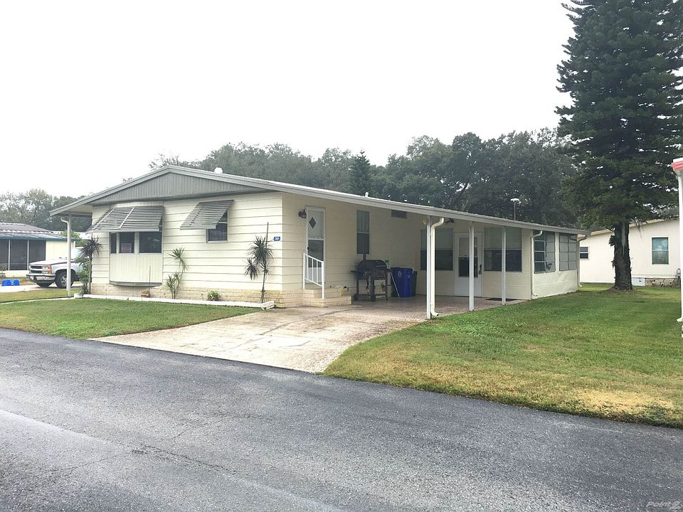 Front of Home with Attached Carport