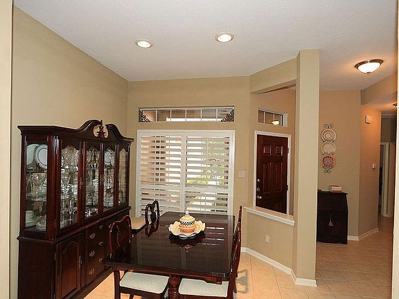 The light and bright dining room is large enough for a china cabinet and dining room table.!