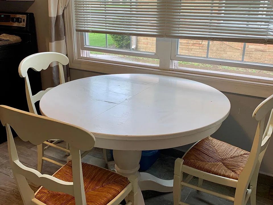 Open dining in kitchen with double windows