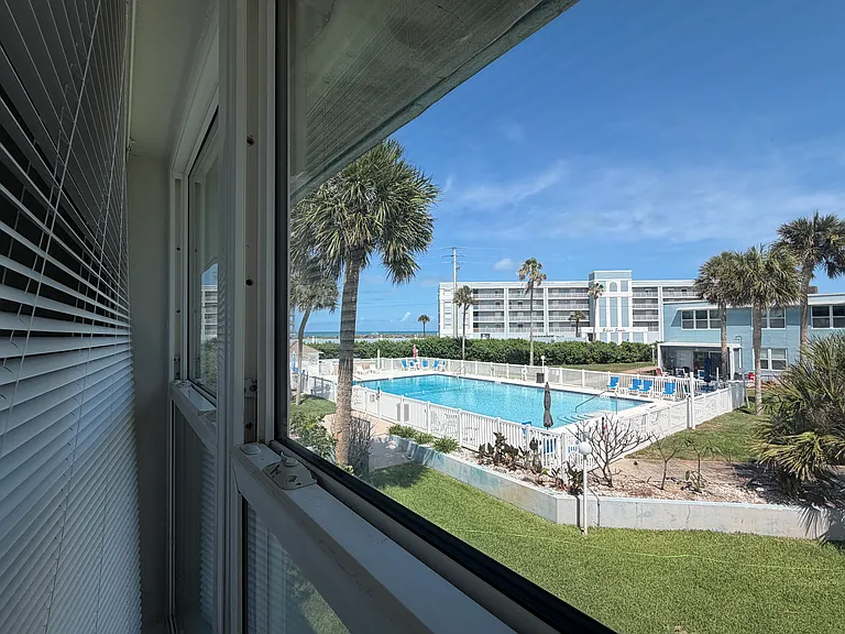 View of the pool (and the ocean), from "your" unit