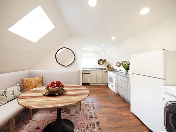 Third floor home, kitchen/laundry staged.