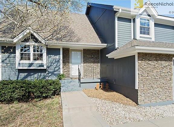 Stone faade enhances the exterior on this home.  New insulated front door.