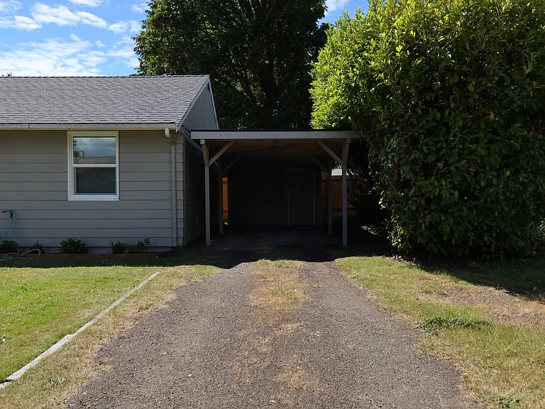 Attached-Carport. Driveway fits 3+ cars.