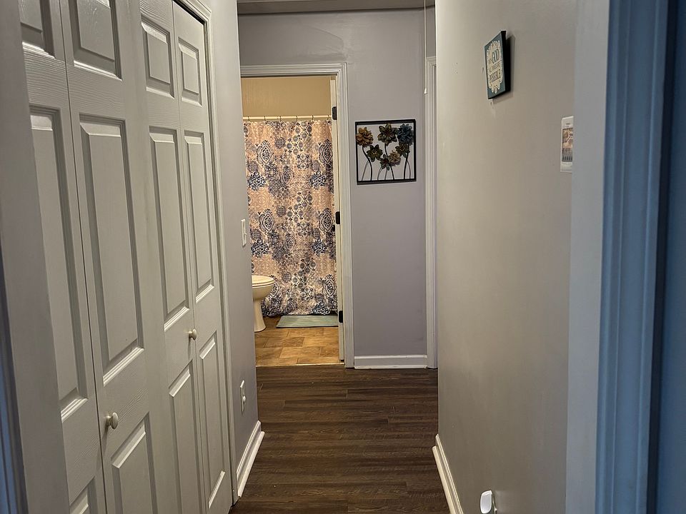 Laundry room on the left. Guest full bath end of the hall.