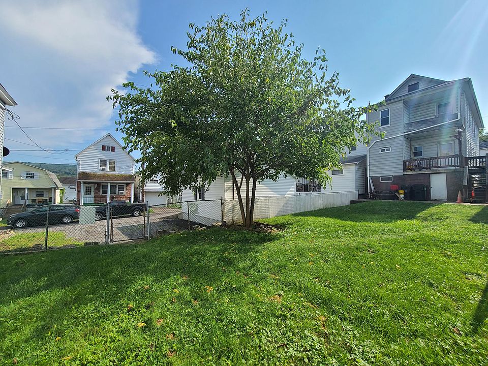 Fenced in backyard, with 3 spaces for parking