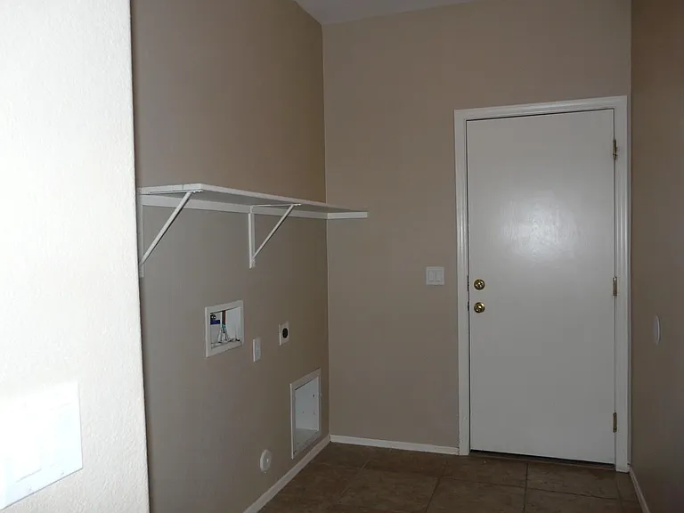 laundry with room for extra Fridge or freezer