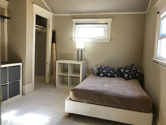 2nd bedroom, slightly smaller than the main bedroom. Lots of bright light coming in through double paned, vinyl windows