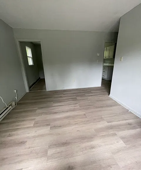 Living area looking toward dining and kitchen area