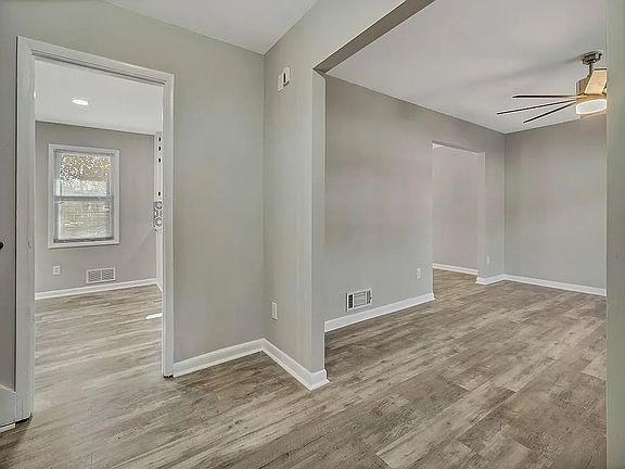 Walk through the front door to a foyer with the living/family room to the right and the eat-in kitchen directly ahead. The foyer has a coat closet and small staircase to the left that leads up to the bedrooms.