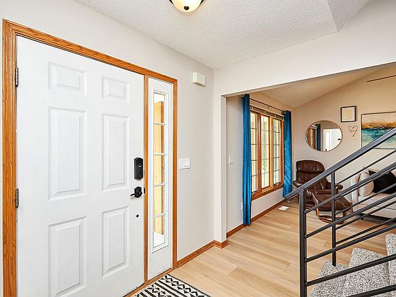 Entry to living room and stairs to second floor
