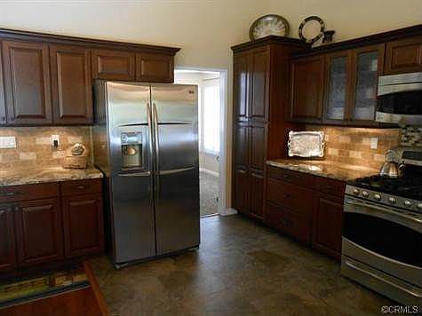 View of kitchen leading to formal dining room