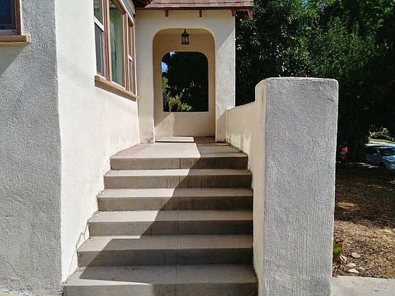 Formal Entry. The exterior of the home is in the process of repainting.