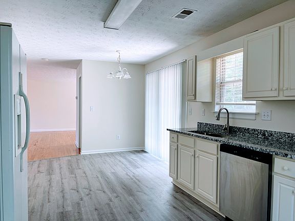 Kitchen and breakfast area with NEW venil flooring.
