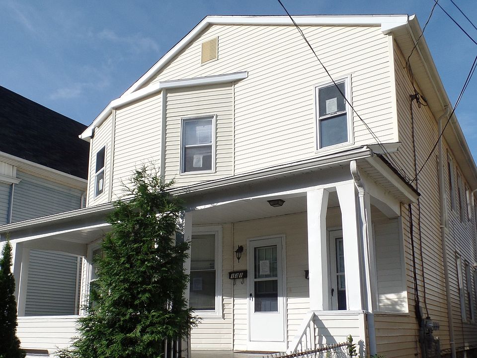 Spacious North End Two Family Home with Two Car Garage
