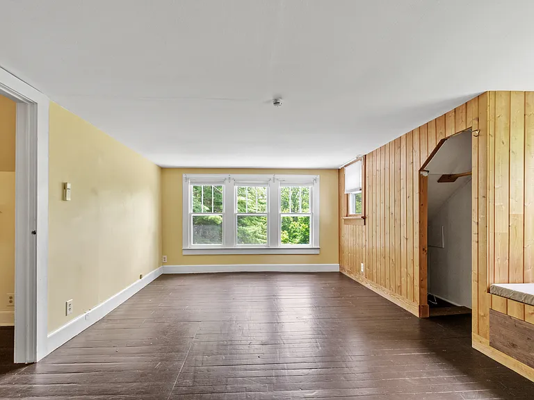 Bedroom 3 (primary suite) is spacious with plenty of closet space and a window seat.