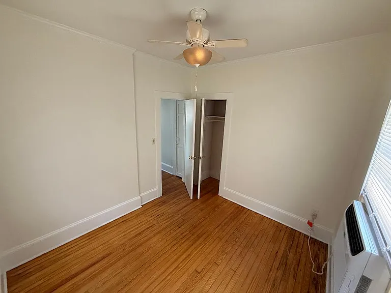 Second bedroom. View from the corner towards the door and storage closet.