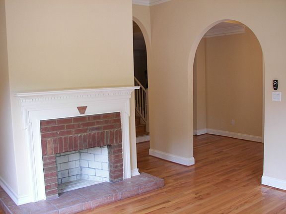 Two Beautiful fireplace and arches accent the living area