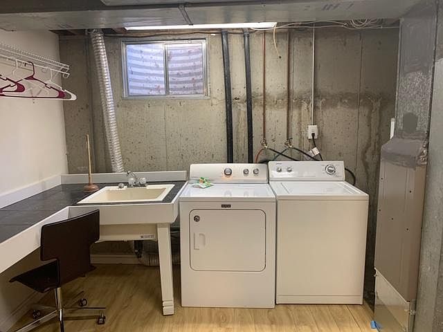 Laundry room through basement recreation room.