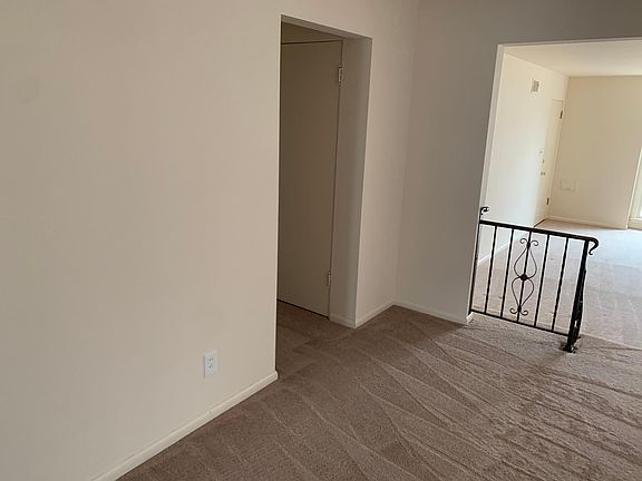 Looking left from the first picture to the hallway with bedrooms